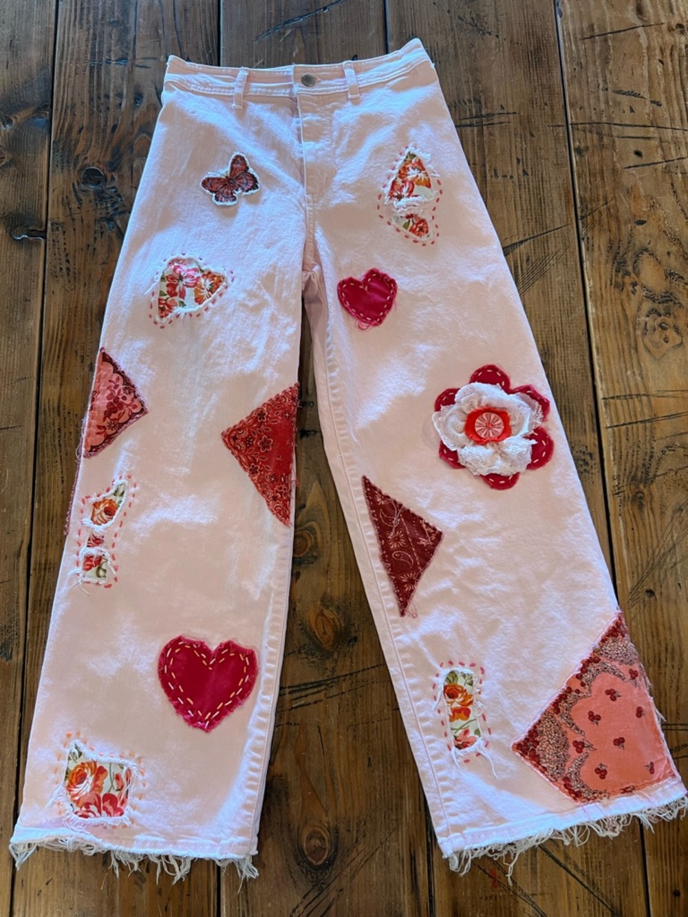 Hand stitched appliqué festival jeans size 4